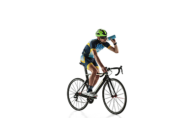 Image showing Triathlon male athlete cycle training isolated on white studio background