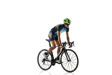 Image showing Triathlon male athlete cycle training isolated on white studio background