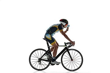 Image showing Triathlon male athlete cycle training isolated on white studio background