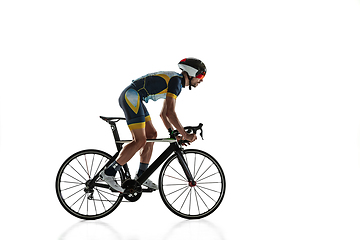 Image showing Triathlon male athlete cycle training isolated on white studio background