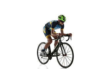 Image showing Triathlon male athlete cycle training isolated on white studio background