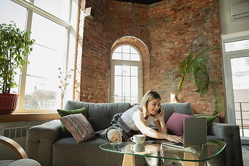 Image showing Caucasian woman, freelancer during the work in home office while quarantine