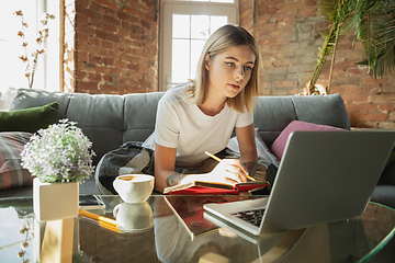 Image showing Caucasian woman, freelancer during the work in home office while quarantine