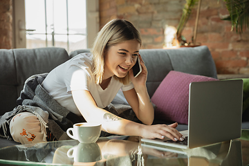 Image showing Caucasian woman, freelancer during the work in home office while quarantine