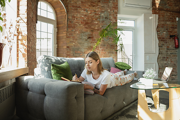 Image showing Caucasian woman, freelancer during the work in home office while quarantine