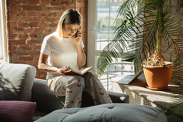 Image showing Caucasian woman, freelancer during the work in home office while quarantine