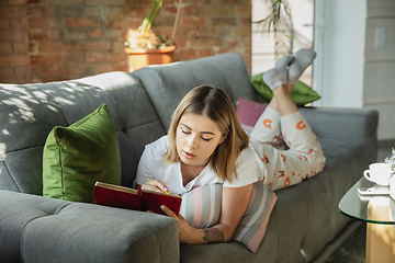 Image showing Caucasian woman, freelancer during the work in home office while quarantine