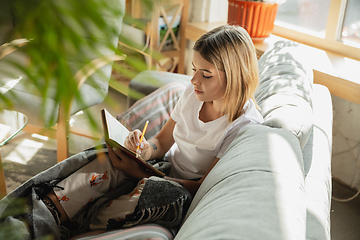 Image showing Caucasian woman, freelancer during the work in home office while quarantine