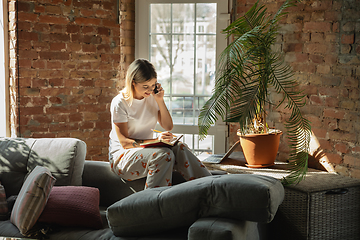 Image showing Caucasian woman, freelancer during the work in home office while quarantine