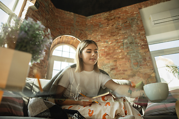 Image showing Caucasian woman, freelancer during the work in home office while quarantine