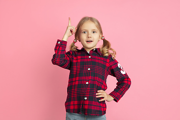 Image showing Caucasian little girl\'s portrait on pink studio background