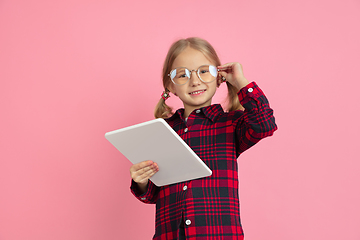 Image showing Caucasian little girl\'s portrait on pink studio background