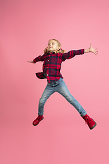 Image showing Caucasian little girl\'s portrait on pink studio background