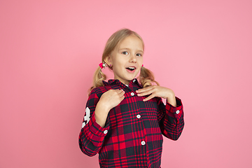 Image showing Caucasian little girl\'s portrait on pink studio background