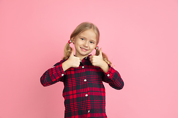 Image showing Caucasian little girl\'s portrait on pink studio background