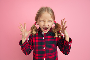 Image showing Caucasian little girl\'s portrait on pink studio background