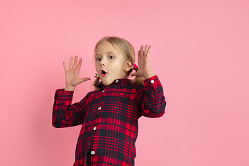 Image showing Caucasian little girl\'s portrait on pink studio background