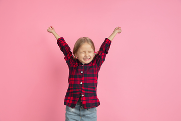 Image showing Caucasian little girl\'s portrait on pink studio background