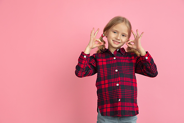 Image showing Caucasian little girl\'s portrait on pink studio background