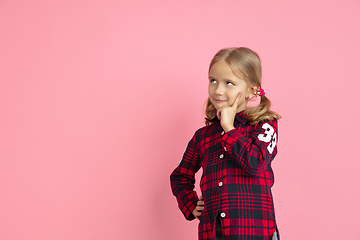 Image showing Caucasian little girl\'s portrait on pink studio background