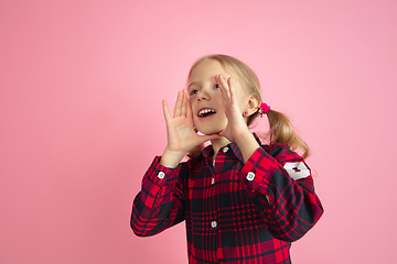 Image showing Caucasian little girl\'s portrait on pink studio background