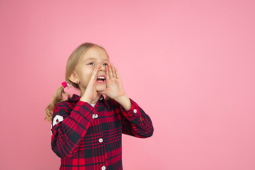 Image showing Caucasian little girl\'s portrait on pink studio background