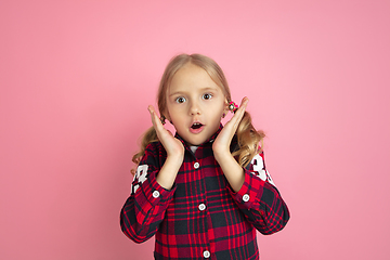 Image showing Caucasian little girl\'s portrait on pink studio background