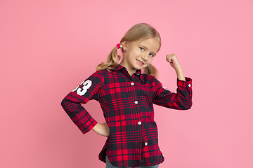 Image showing Caucasian little girl\'s portrait on pink studio background