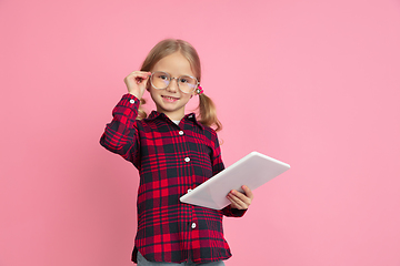 Image showing Caucasian little girl\'s portrait on pink studio background