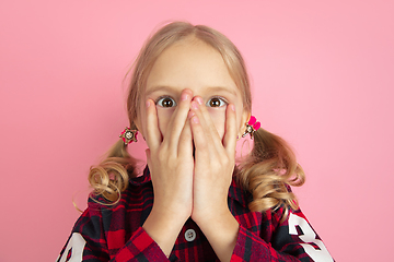 Image showing Caucasian little girl\'s portrait on pink studio background