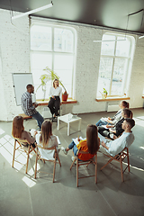 Image showing Female caucasian speaker giving presentation in hall at university or business centre workshop