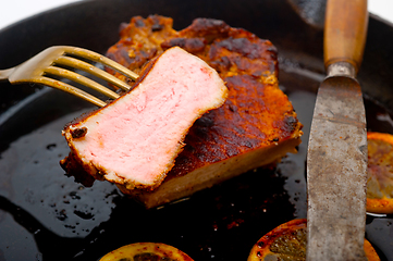 Image showing pork chop seared on iron skillet