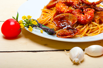 Image showing Italian seafood spaghetti pasta on red tomato sauce