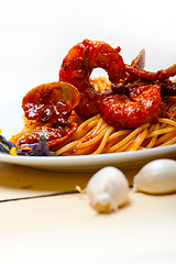 Image showing Italian seafood spaghetti pasta on red tomato sauce