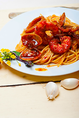 Image showing Italian seafood spaghetti pasta on red tomato sauce