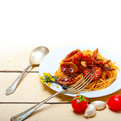 Image showing Italian seafood spaghetti pasta on red tomato sauce