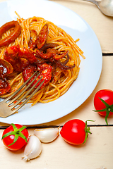 Image showing Italian seafood spaghetti pasta on red tomato sauce