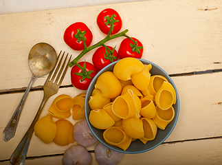 Image showing Italian snail lumaconi pasta with tomatoes