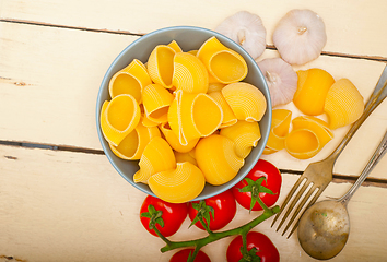 Image showing Italian snail lumaconi pasta with tomatoes