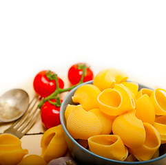 Image showing Italian snail lumaconi pasta with tomatoes