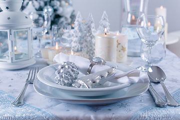 Image showing Festive Christmas table in snowy white