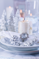 Image showing Festive Christmas table in snowy white