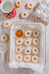 Image showing Homemade Christmas cookies with baking ingredients in white