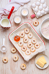 Image showing Homemade Christmas cookies with baking ingredients in white