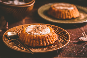 Image showing Homemade small pumpkin pies with icing for Thanksgiving