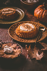 Image showing Homemade small pumpkin pies with icing for Thanksgiving