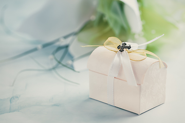 Image showing First holy communion or confirmation - small present and flowers