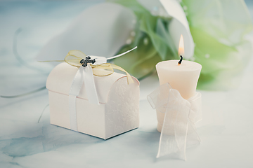 Image showing First holy communion or confirmation - candle,  small present an