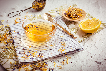 Image showing Cup of herbal tea with lemon