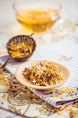 Image showing Herbal tea with infuser and cupe of tea